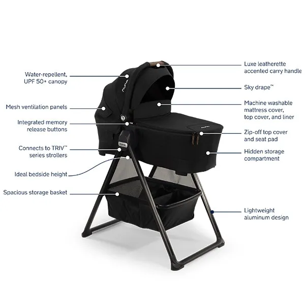 Hands registering a Nuna stroller warranty on a desk
