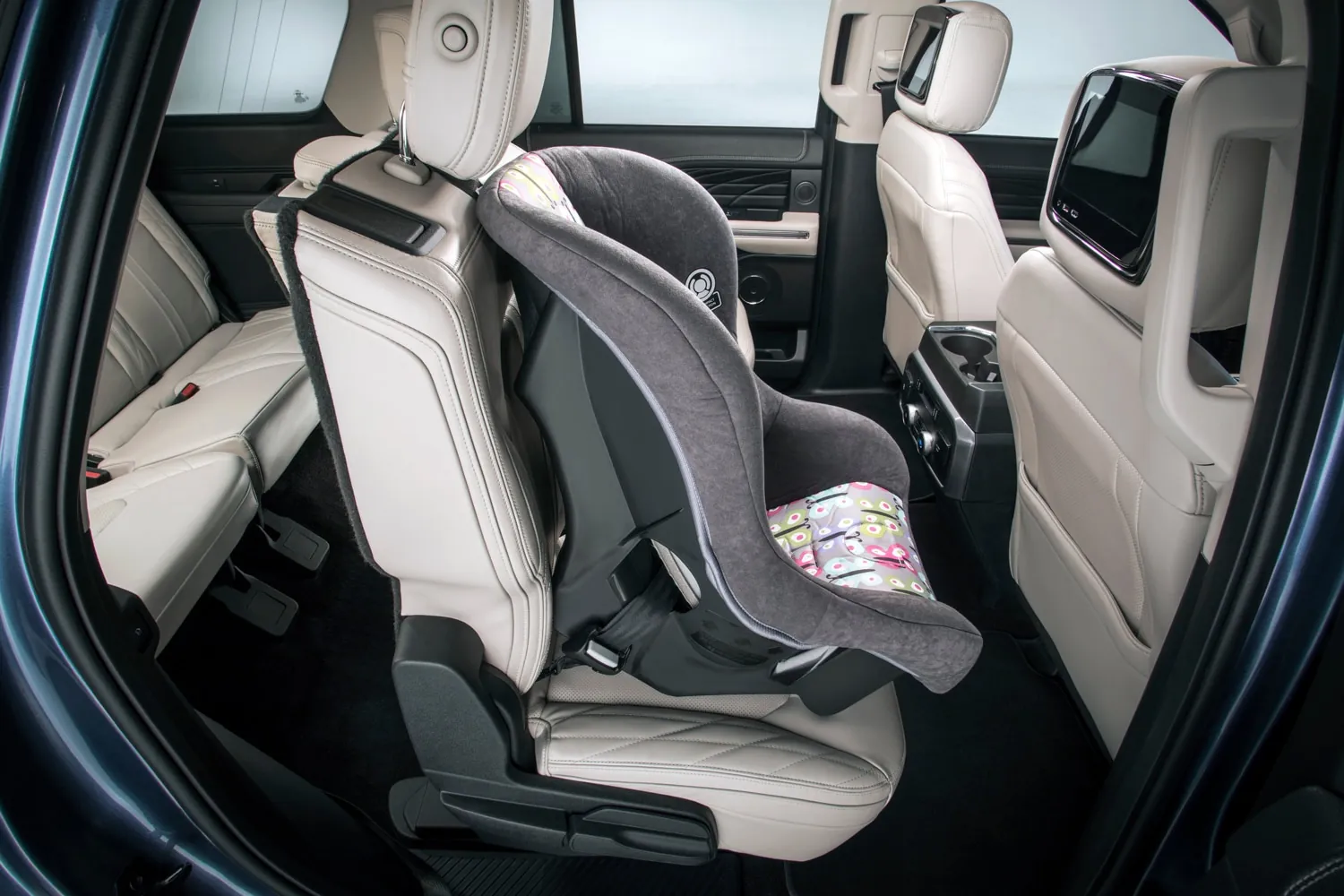 Measuring tape beside car seat indicating height limit check