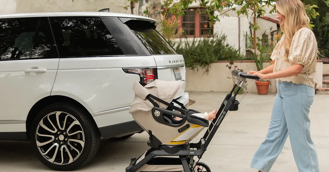Person calling thrift store before donating a blue stroller